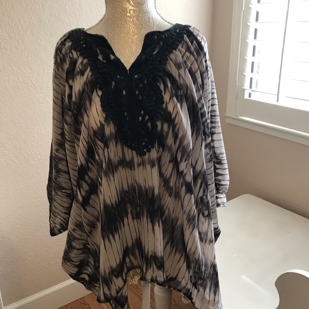 Isabella Rodriguez black and white blouse